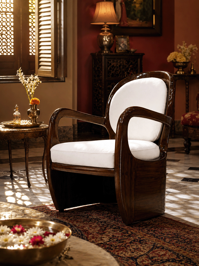 Aureo accent chair in a traditional Indian-style interior with brass decor