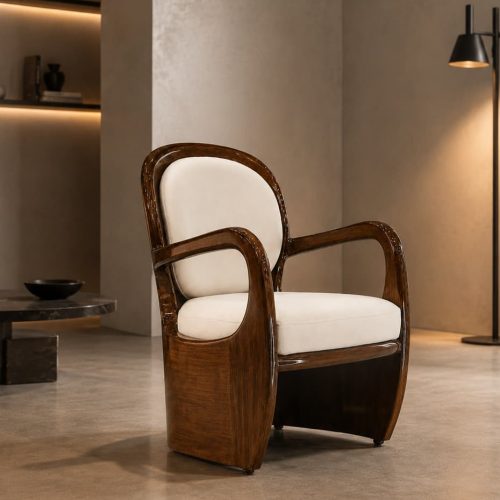 Aureo accent chair with glossy mahogany frame and cream cushions in a modern lounge