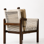 Solace Lounge Chair back angle showing cane weave and tan seat cushion