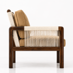 Solace Lounge Chair side profile with tan cushion and cane-wrapped armrest