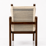 Solace Lounge Chair rear view showing woven cane backrest and dark wood frame