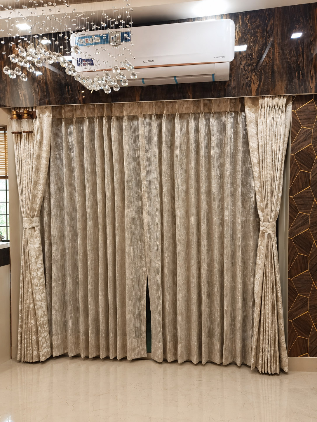 Luxury pleated curtains with chandelier detail in a Kolkata home installed by Avikar