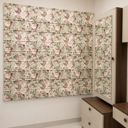 Pink and green vintage floral roman blind installed above a dressing table mirror