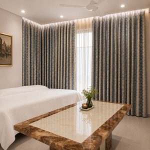 Window Coverings Kolkata: Blinds & Curtains Blue and beige damask curtains with cove ceiling lighting in a living room