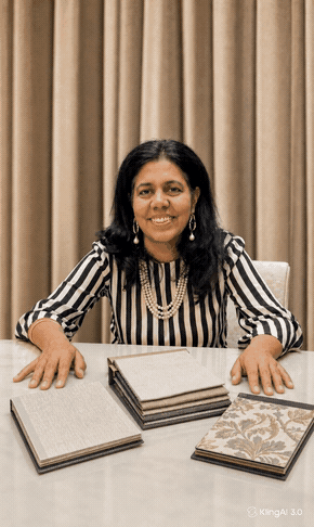 Furnishing Gaitry Sood, Avikar interior stylist, reviewing fabric swatches with a customer