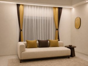 Window Coverings Kolkata: Blinds & Curtains Gold and brown pleated curtains with sheer panel above a beige sofa, Avikar Kolkata