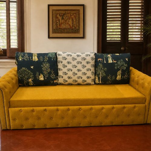 Mustard tufted Chesterfield sofa-cum-bed in sofa mode in a traditional Bengali living room in Kolkata — Avikar