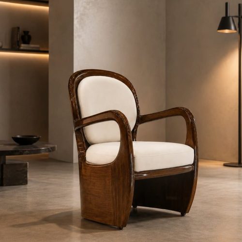 Aureo accent chair with glossy mahogany frame and cream cushions in a modern lounge